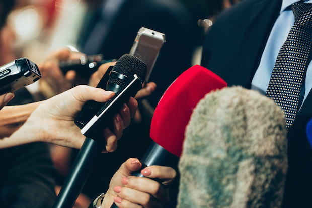 Interviewing business man on press conference